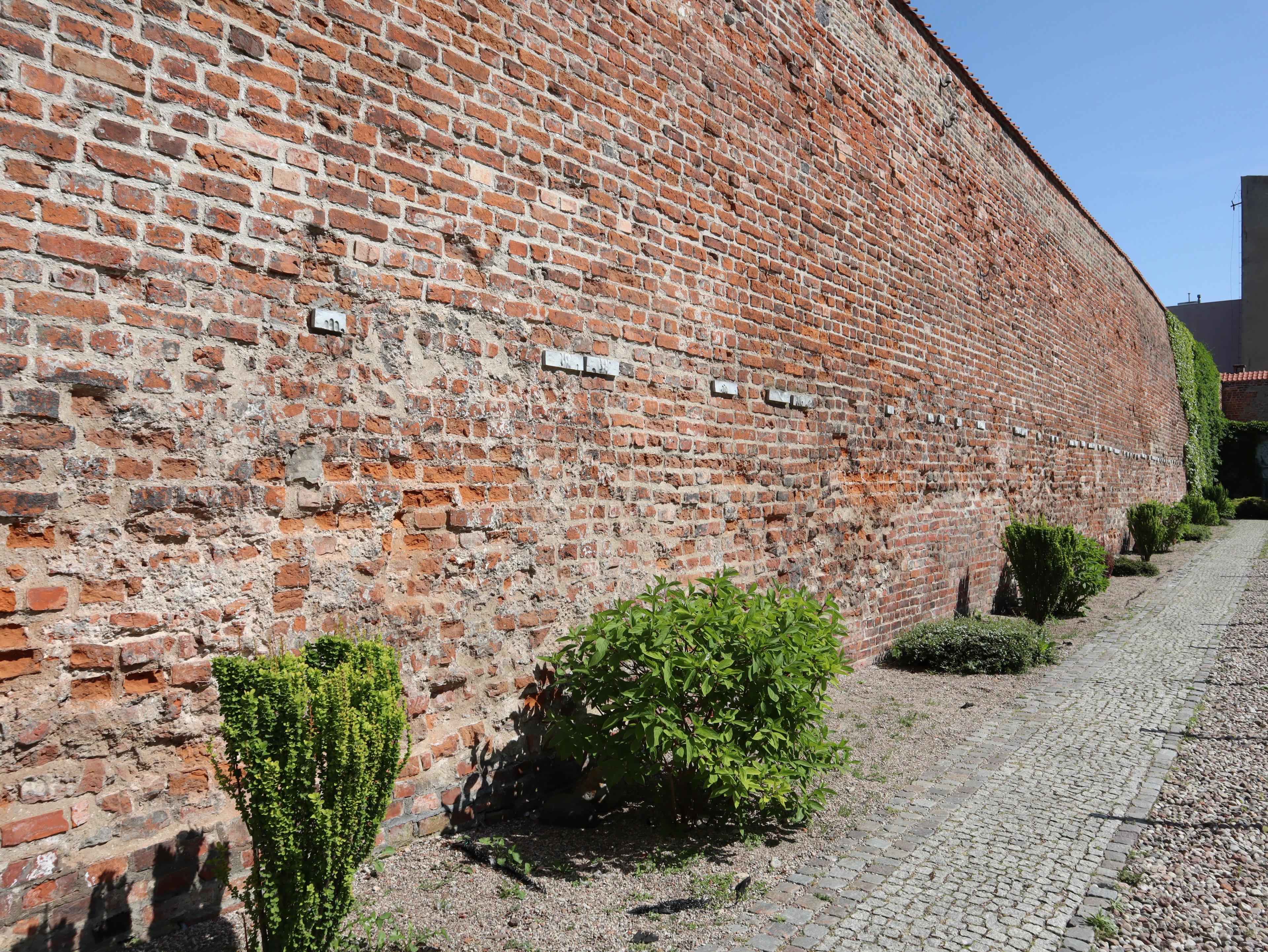 Wall by the post office with symbolic imprints of executed postal workers