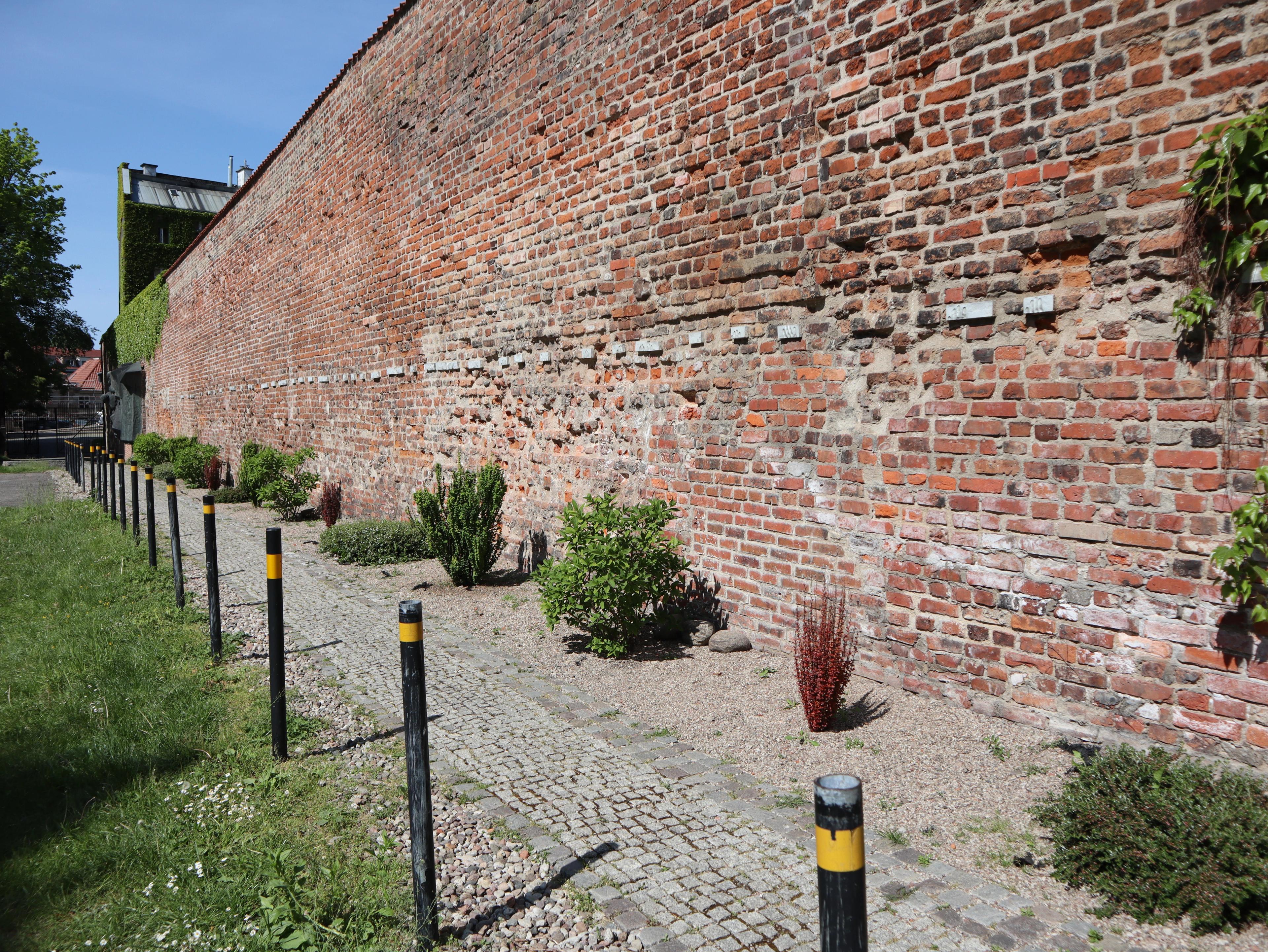 Wall by the post office with symbolic imprints of executed postal workers 2